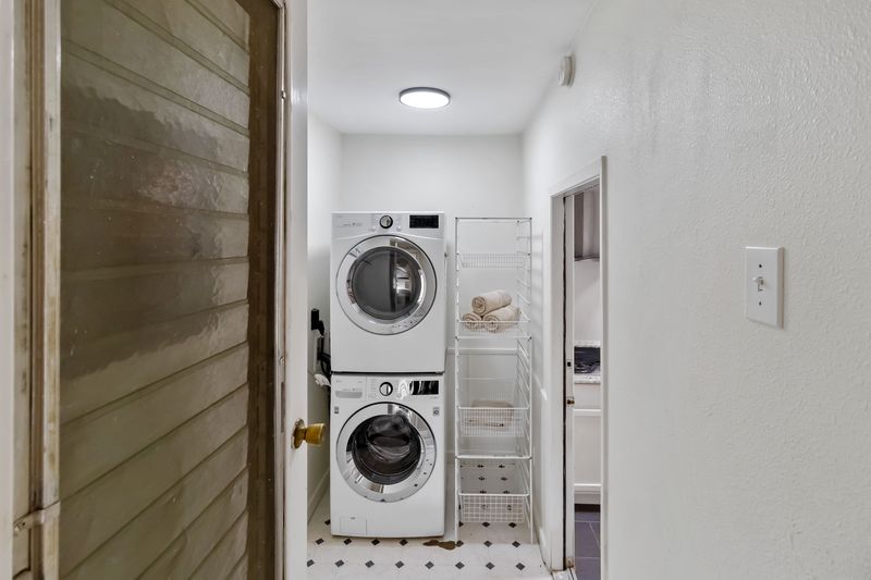 605 West 11th Street Elgin, TX 78621 - Photo 23 of 31 Laundry room with stacked washer and Dryer