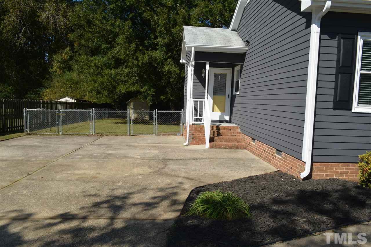 5236 Carrier Way Raleigh, NC 27603 - Photo 22 of 22 Paved concrete driveway with extra paved parking, bonus covered side entrance too! Schedule now-don't miss out!