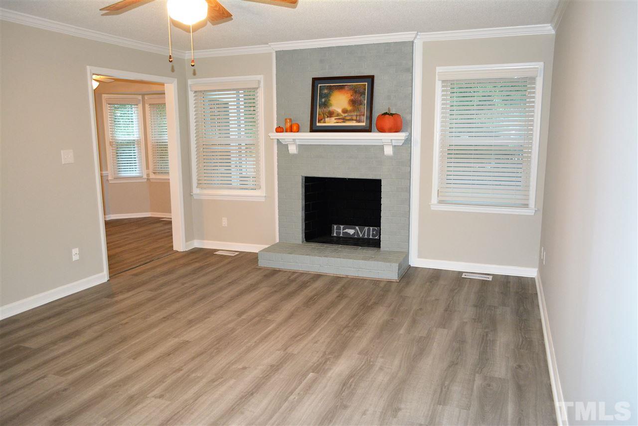 5236 Carrier Way Raleigh, NC 27603 - Photo 6 of 22 Beautiful brick fireplace, nice 2 inch blinds!