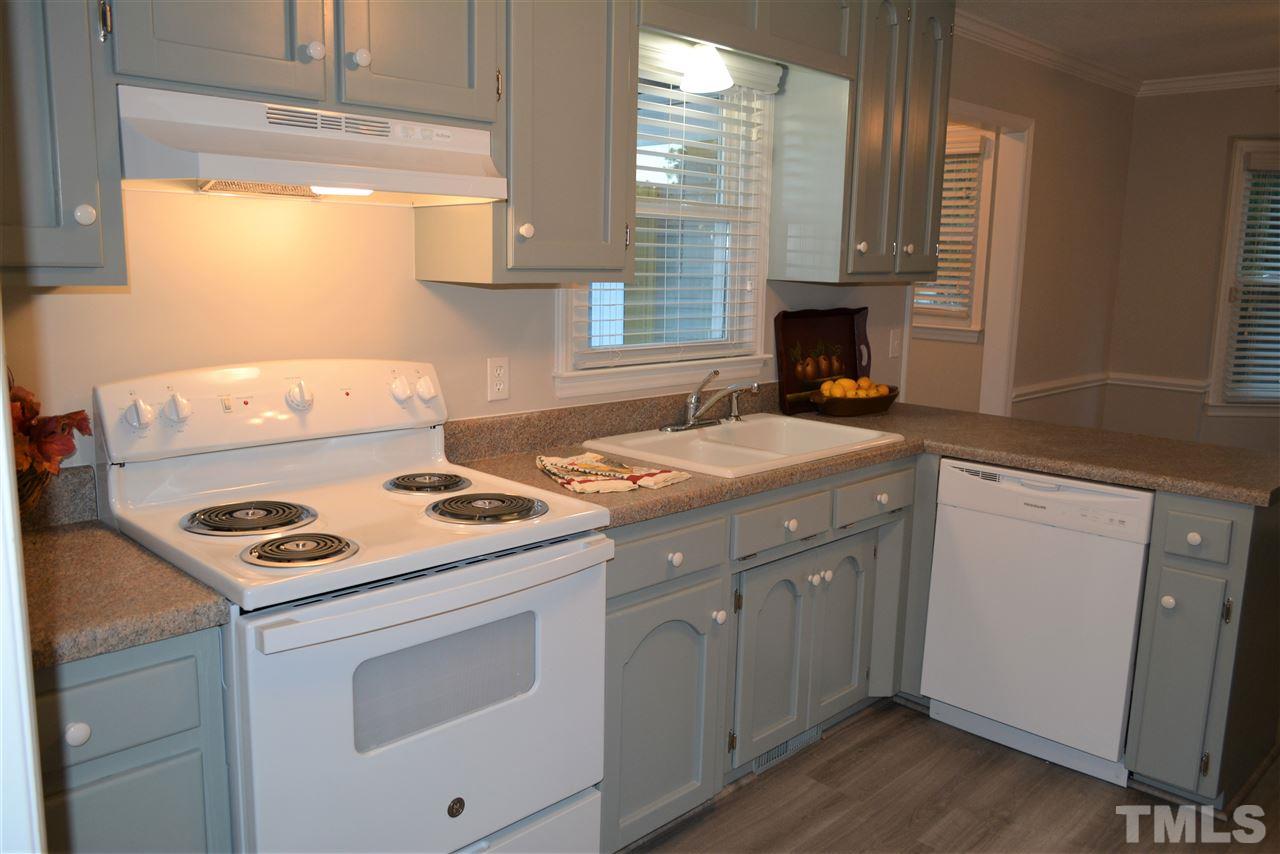 5236 Carrier Way Raleigh, NC 27603 - Photo 9 of 22 New paint, new painted cabinets, new appliances!