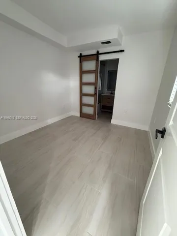 a view of an empty room with a fireplace