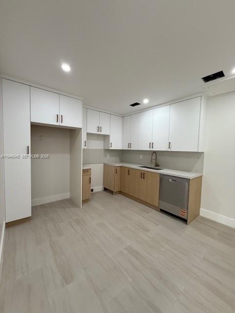 9007 Southwest 38th Street, Unit 9005 Miami, FL 33165 - Photo 3 of 7 a large kitchen with a large counter top a sink stainless steel appliances and cabinets