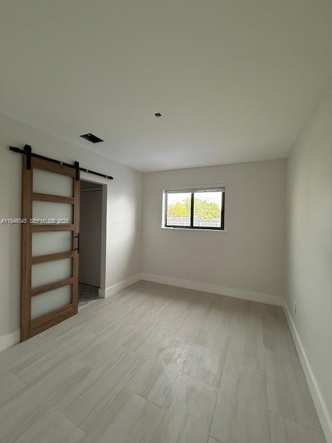 9007 Southwest 38th Street, Unit 9005 Miami, FL 33165 - Photo 6 of 7 a view of an empty room with a window
