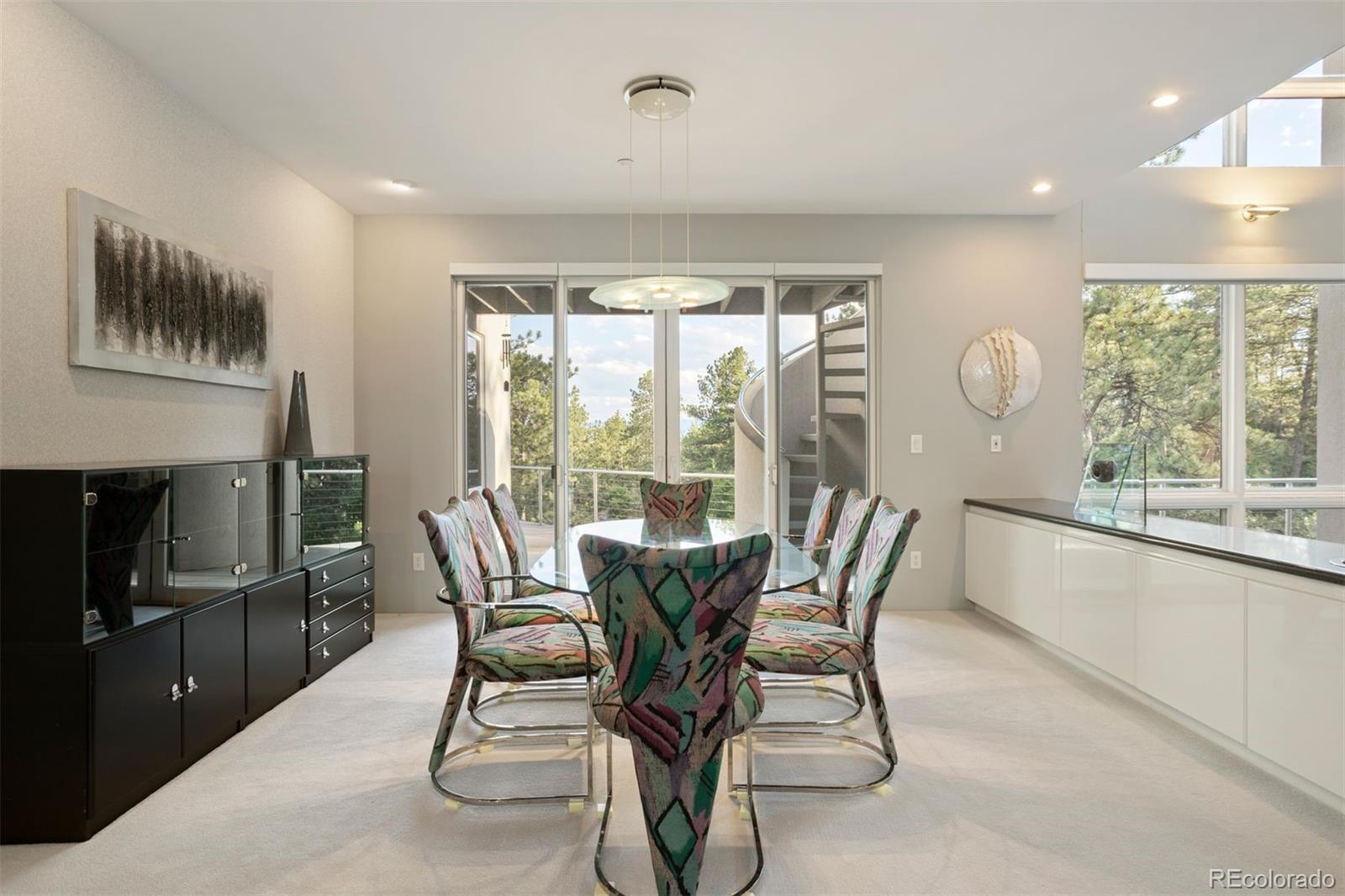 7 Elk Pointe Lane Castle Rock, CO 80108 - Photo 11 of 43 a dining room with furniture and a floor to ceiling window