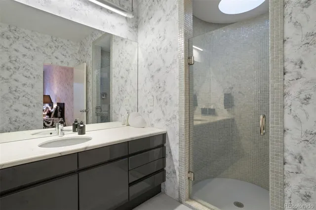 a bathroom with a sink and a mirror