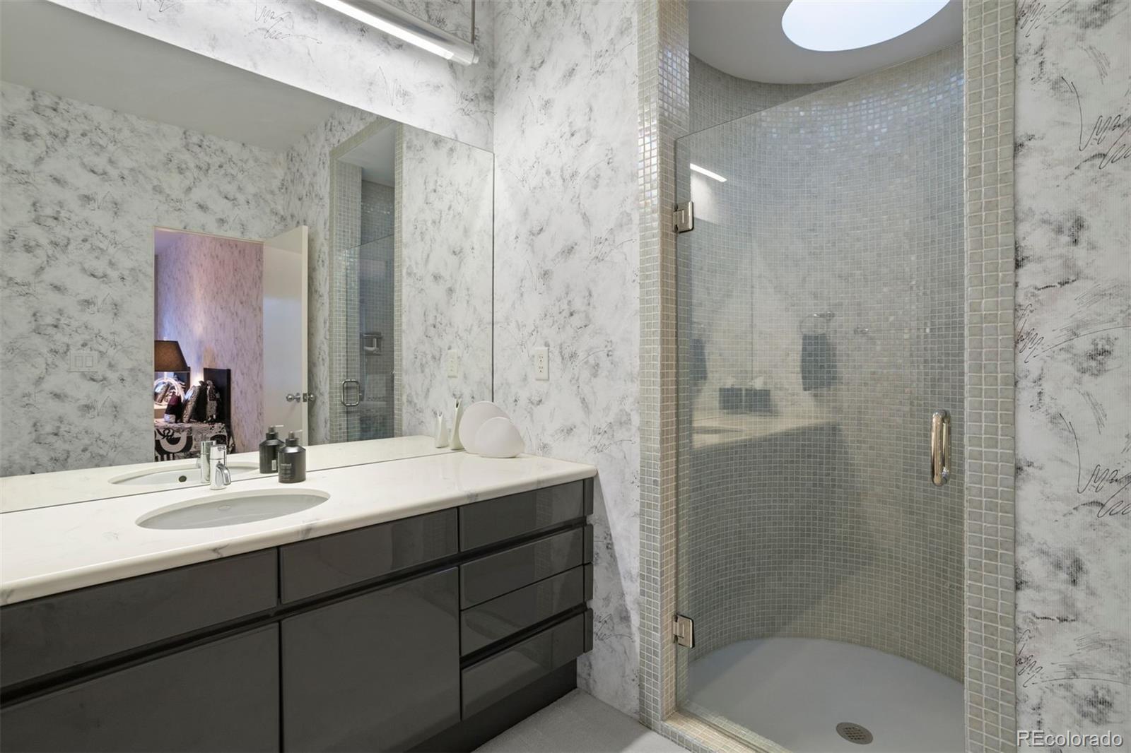 7 Elk Pointe Lane Castle Rock, CO 80108 - Photo 21 of 43 a bathroom with a sink and a mirror