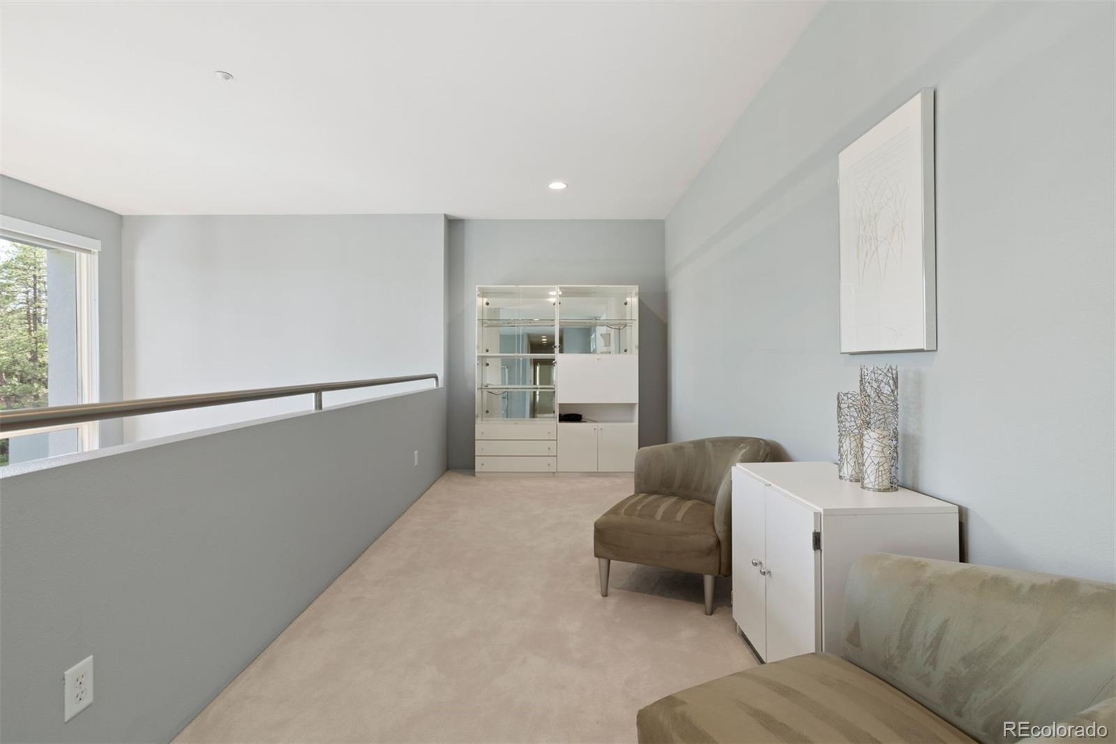 7 Elk Pointe Lane Castle Rock, CO 80108 - Photo 23 of 43 a living room with furniture and window