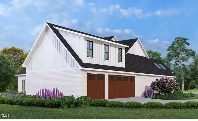 a front view of a house with a garden