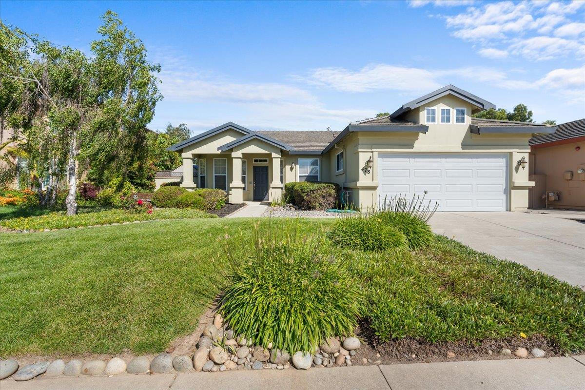478 Churchill Way Salinas, CA 93906 - Photo 1 of 31 a front view of a house with a garden