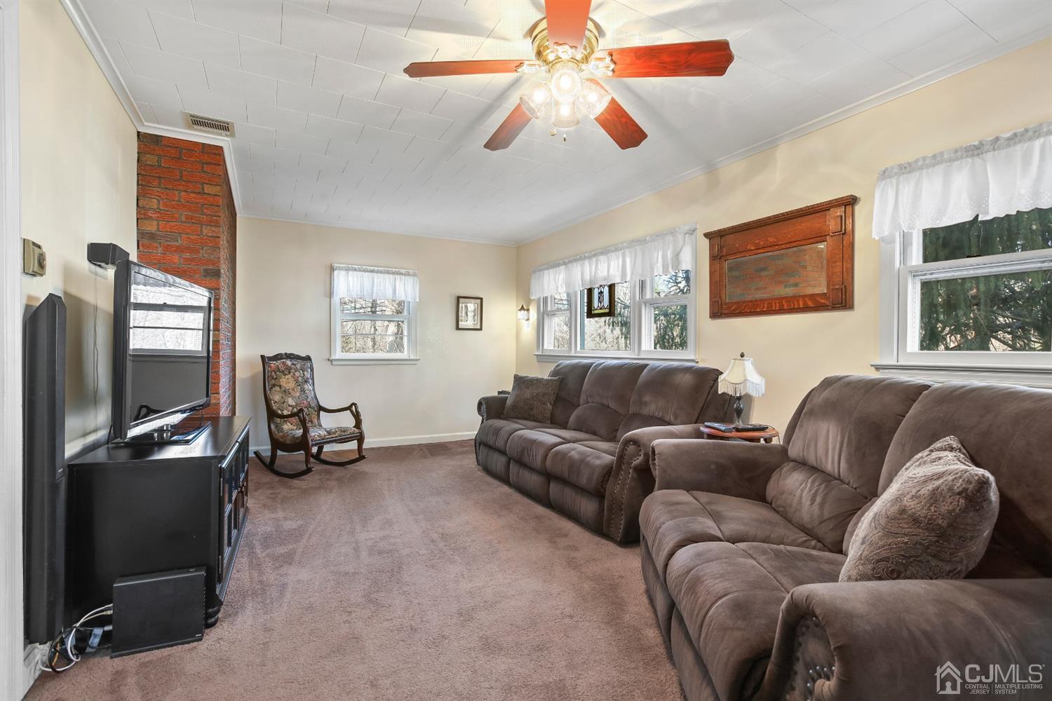 235 Chain O' Hills Road Colonia, NJ 07067 - Photo 14 of 41 a living room with furniture and a flat screen tv