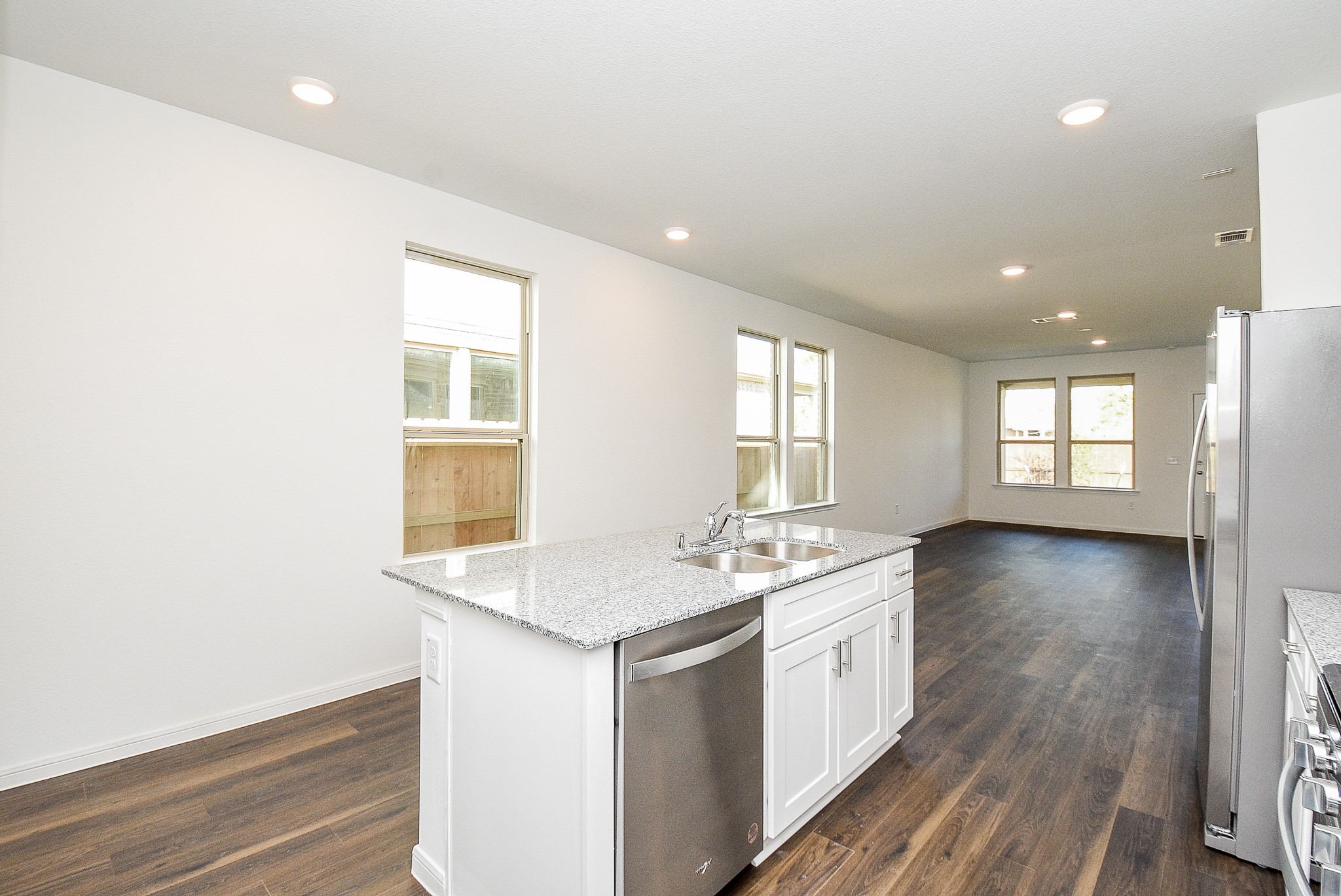 14499 Cedar Br Lane Conroe, TX 77302 - Photo 15 of 32 a view of a kitchen counter space window and wooden floor