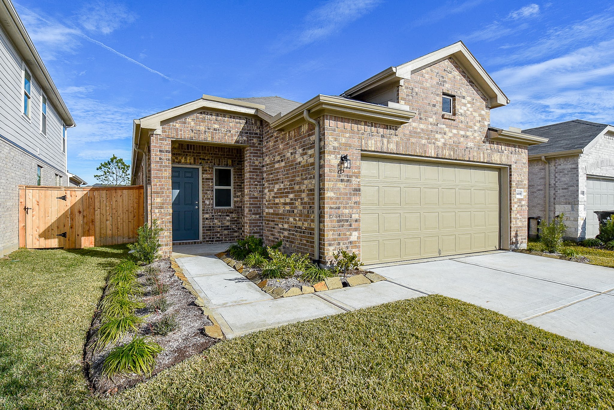 14499 Cedar Br Lane Conroe, TX 77302 - Photo 2 of 32 a front view of a house with a yard