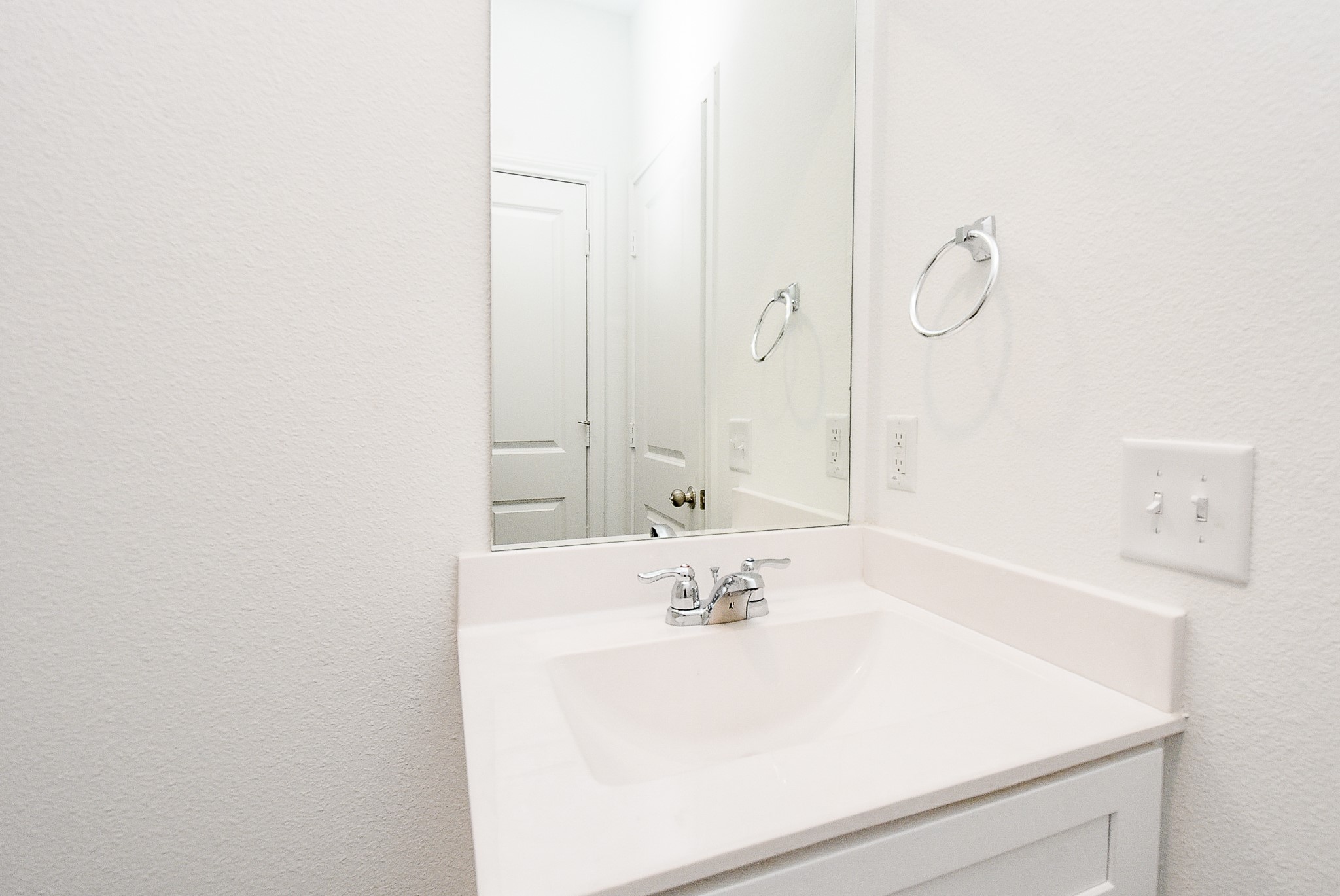 14499 Cedar Br Lane Conroe, TX 77302 - Photo 24 of 32 a bathroom with a sink and a mirror