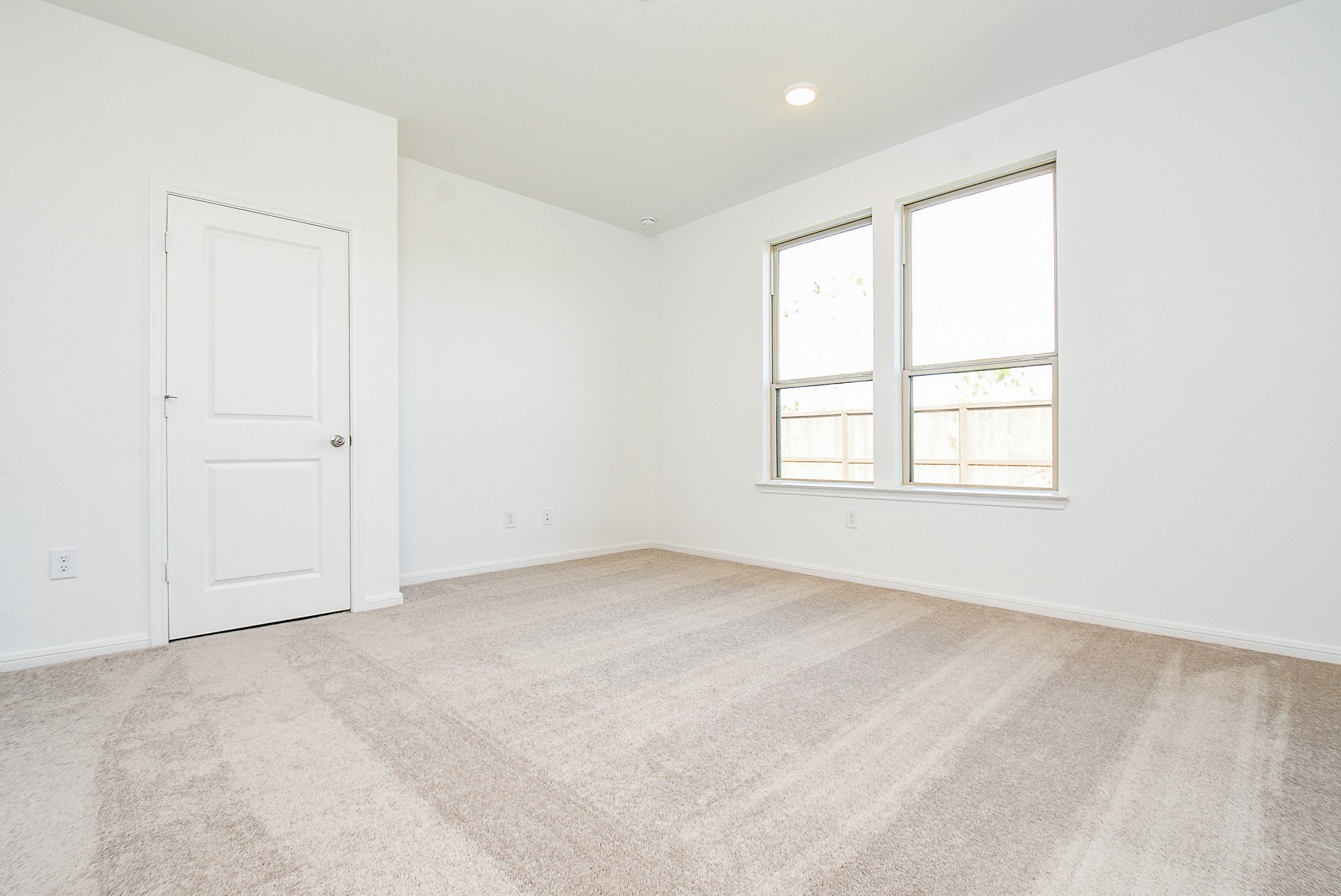 14499 Cedar Br Lane Conroe, TX 77302 - Photo 29 of 32 an empty room with windows