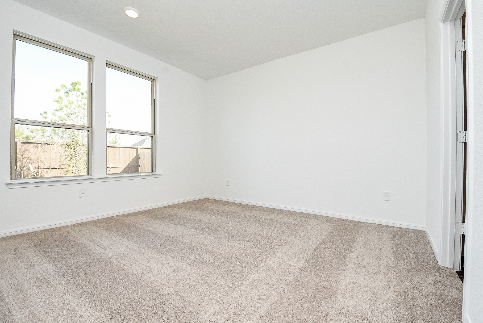 14499 Cedar Br Lane Conroe, TX 77302 - Photo 31 of 32 an empty room with a window