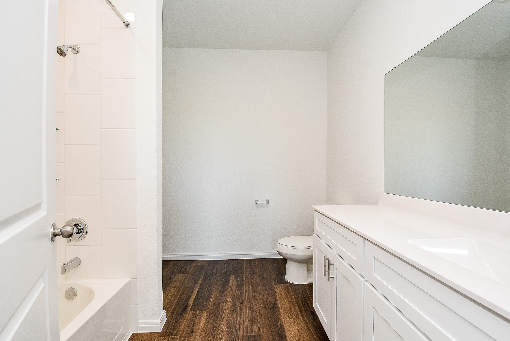 14499 Cedar Br Lane Conroe, TX 77302 - Photo 32 of 32 a bathroom with a sink a toilet and bathtub