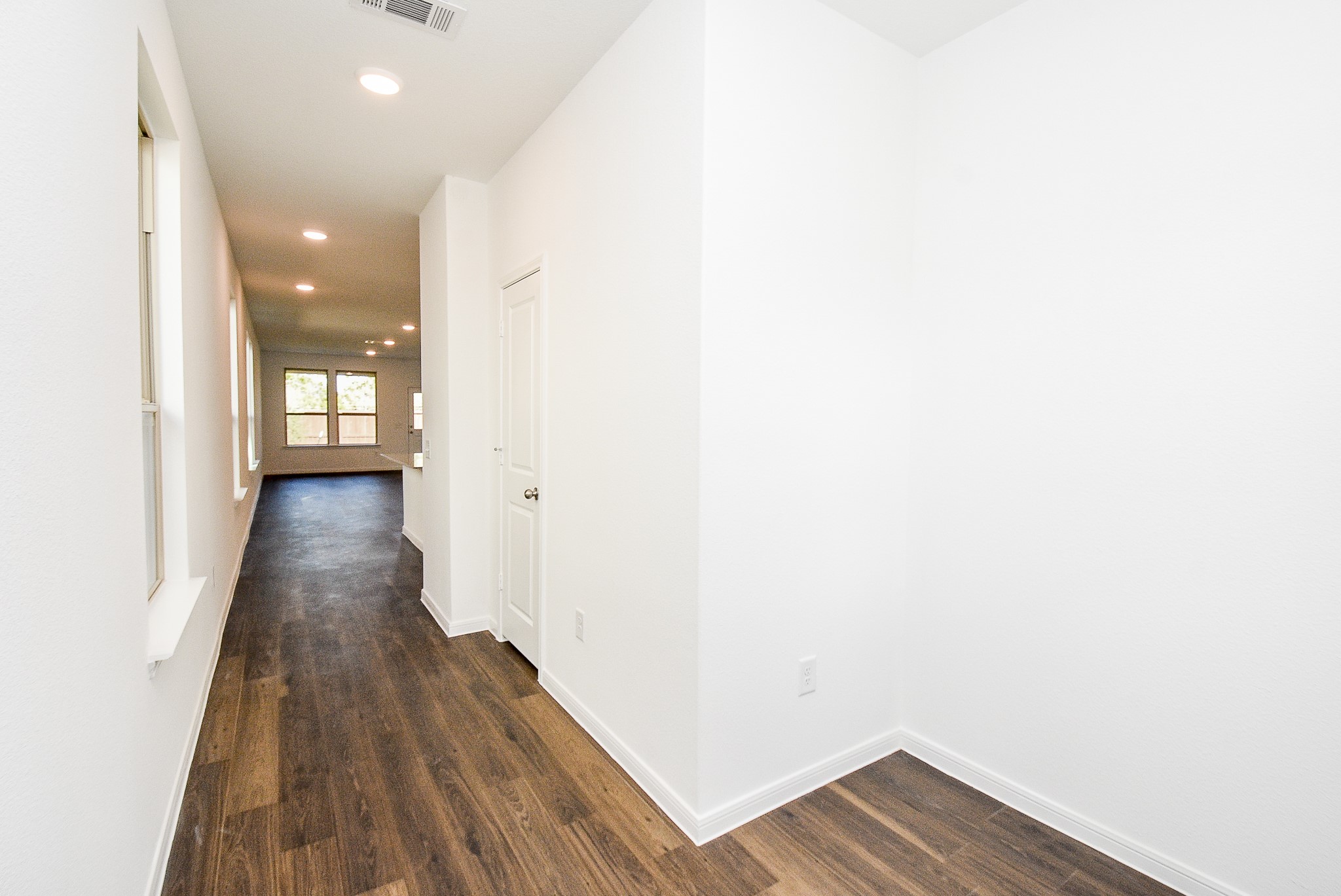 14499 Cedar Br Lane Conroe, TX 77302 - Photo 7 of 32 a view of a hallway with wooden floor