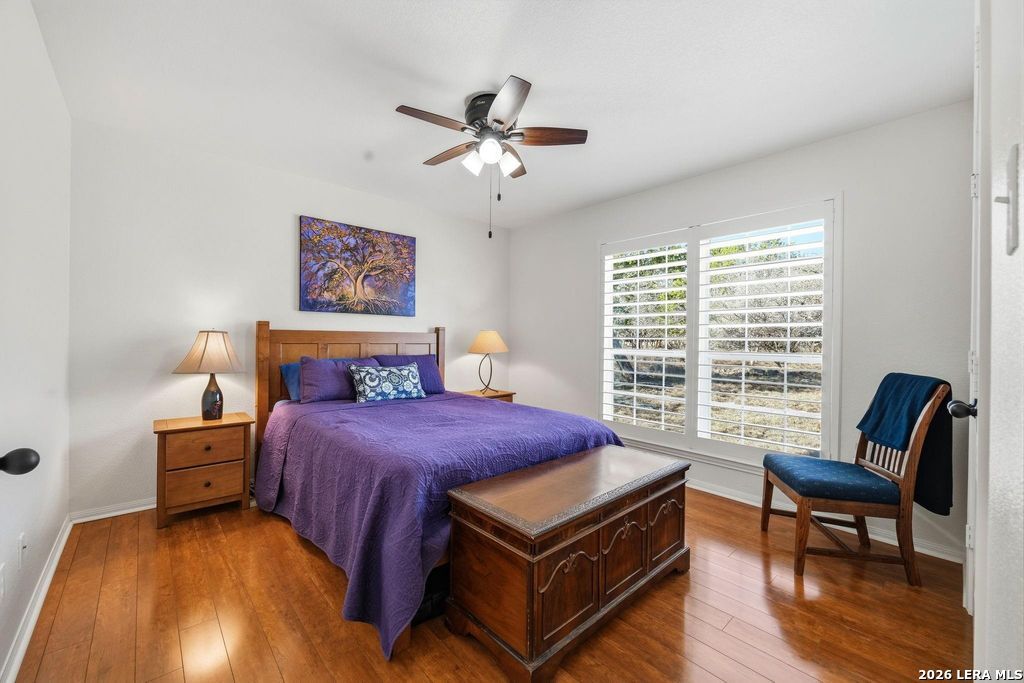 318 River Ridge Boerne, TX 78006 - Photo 31 of 46 a bedroom with a bed and a chair