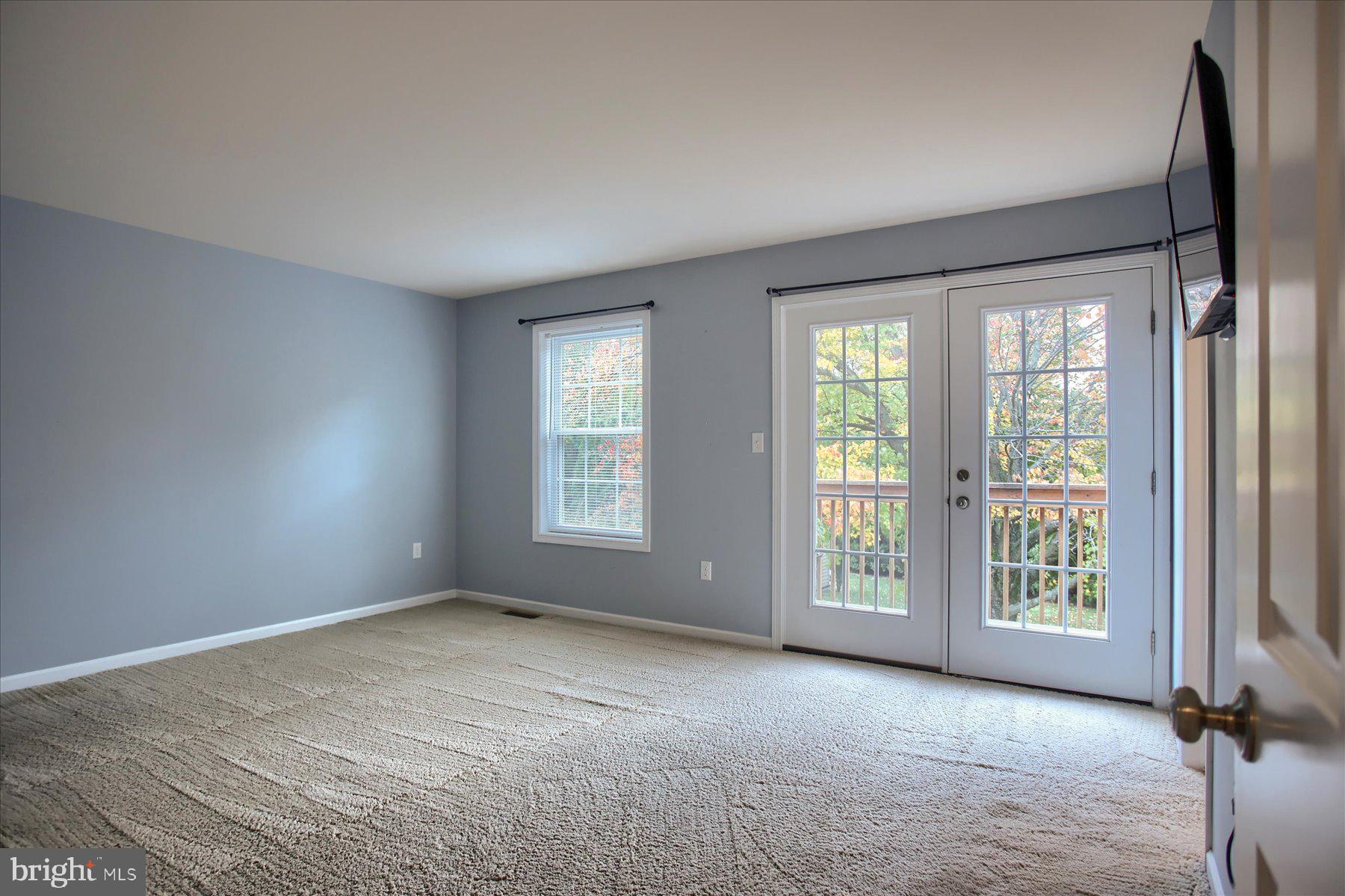 4990 Bossler Road Elizabethtown, PA 17022 - Photo 16 of 41 Primary bedroom W/ French Doors to 2nd Floor Deck