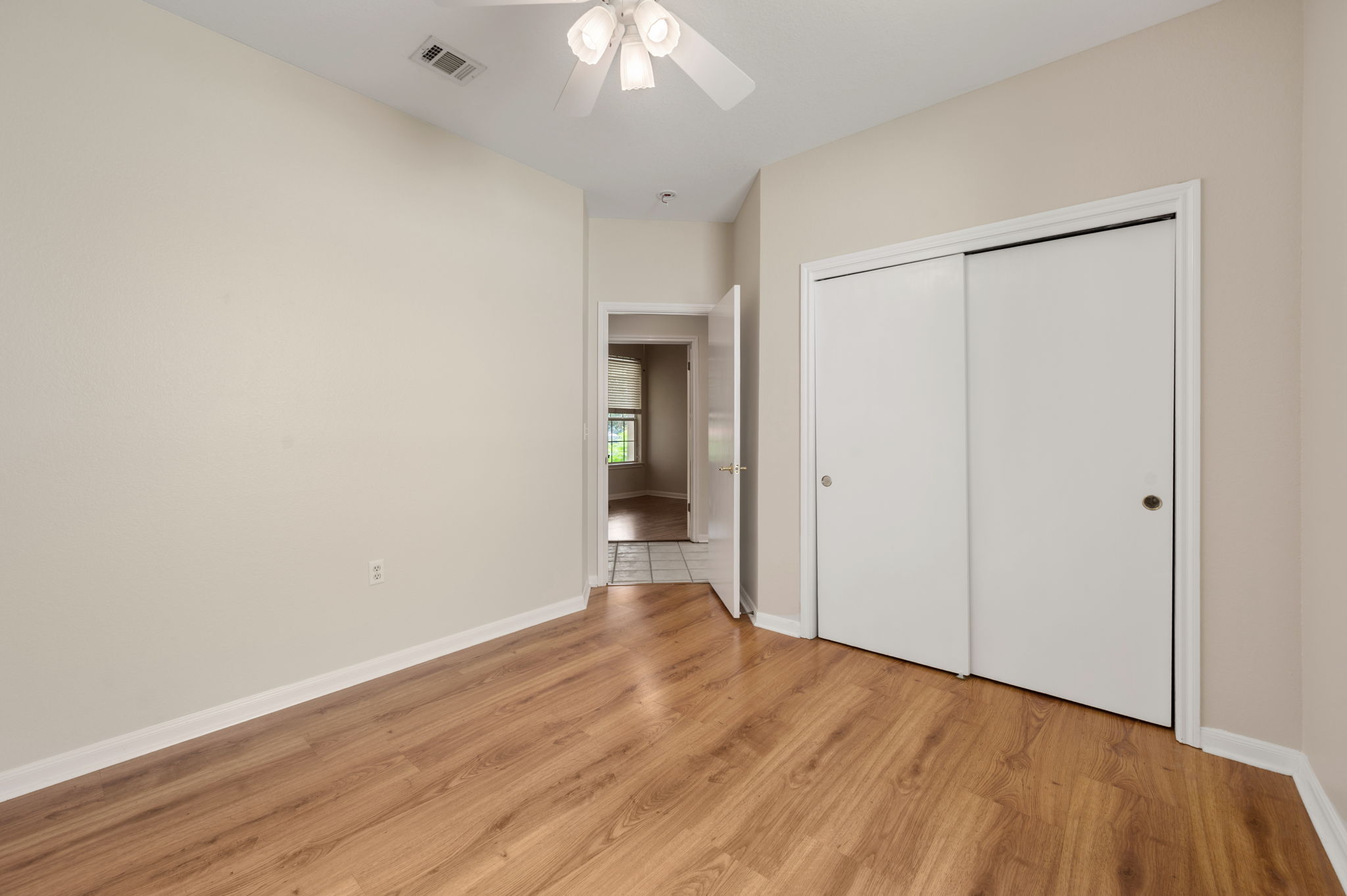 118 Bass Street Georgetown, TX 78633 - Photo 28 of 40 A quiet retreat with durable flooring and ample closet space, ready for your personal touch.