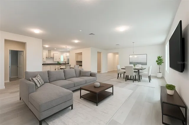 a kitchen with granite countertop white cabinets and sink