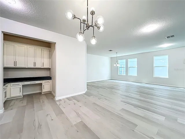 a kitchen with stainless steel appliances granite countertop a sink and stove