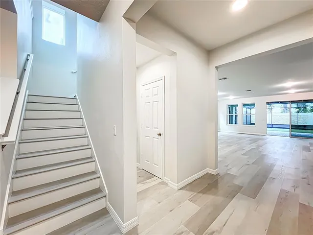 a bathroom with a toilet and bathtub