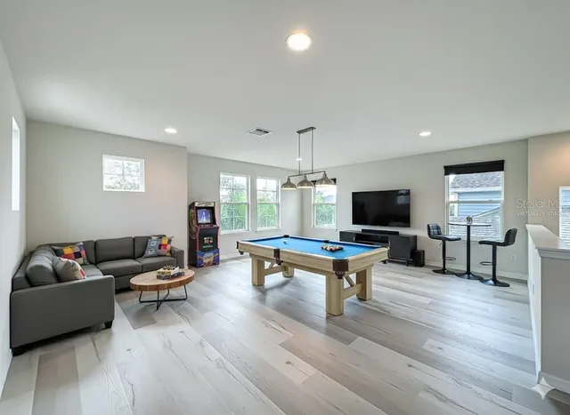 a bedroom with a bed and a couch