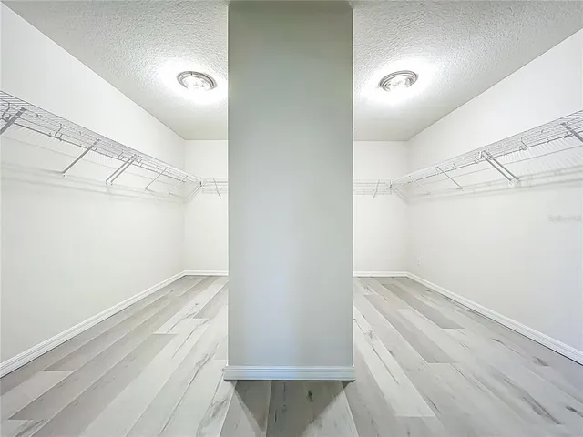 a view of a a dining room with furniture window and wooden floor