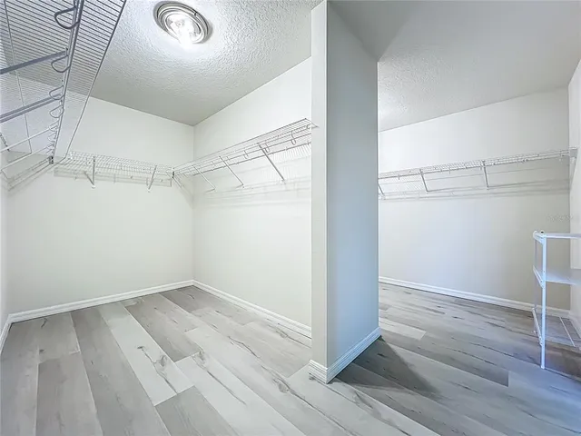 a living room with dining room and a flat screen tv