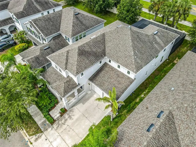a view of a livingroom with wooden floor and a large window
