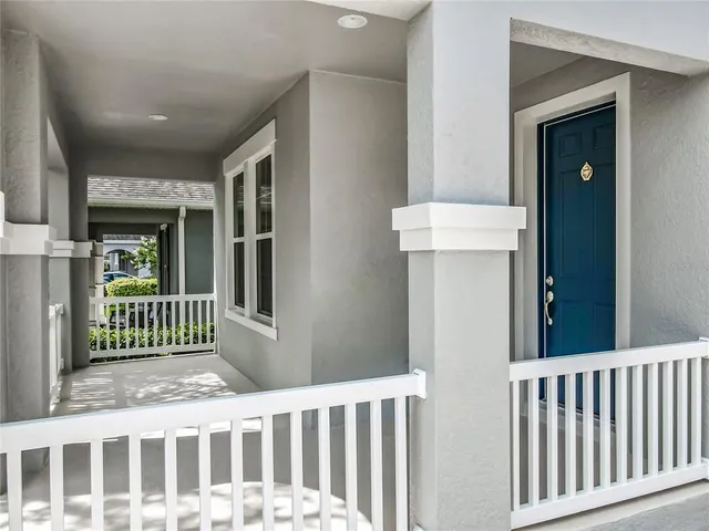 a view of a room with wooden floor and windows