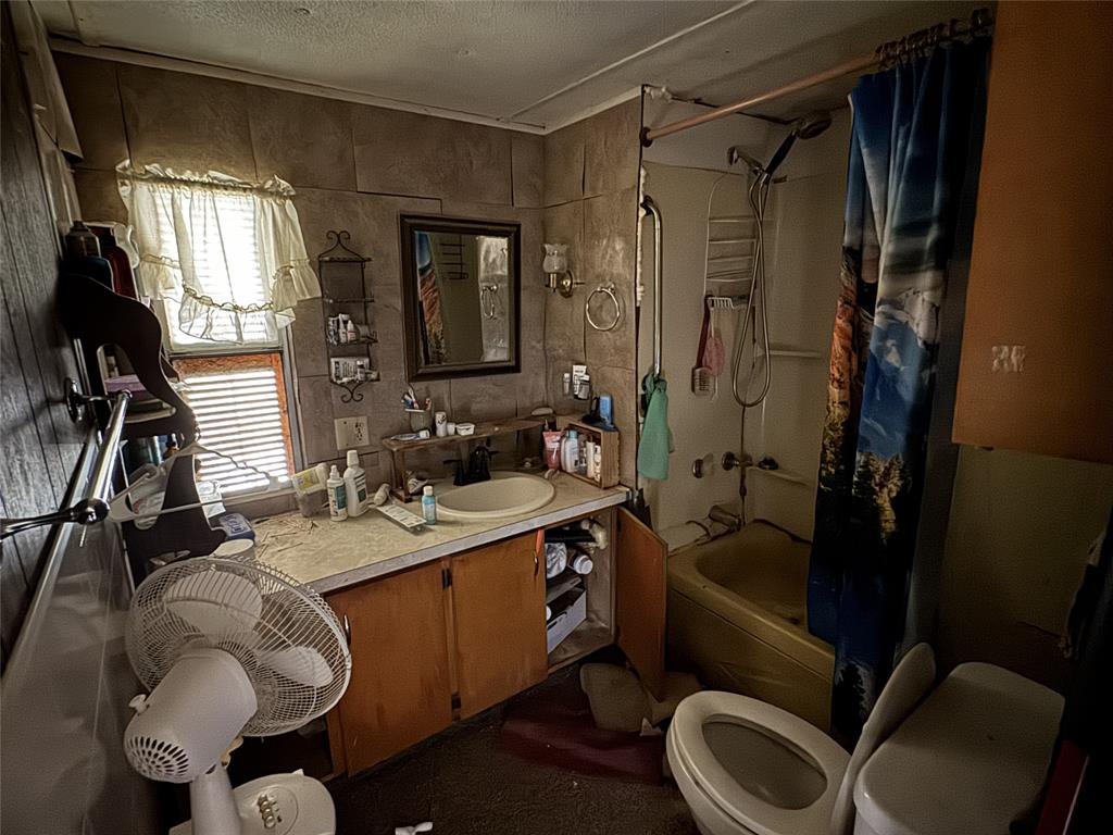 1161 Davis Court Rio Vista, TX 76093 - Photo 5 of 6 a bathroom with a sink toilet and shower