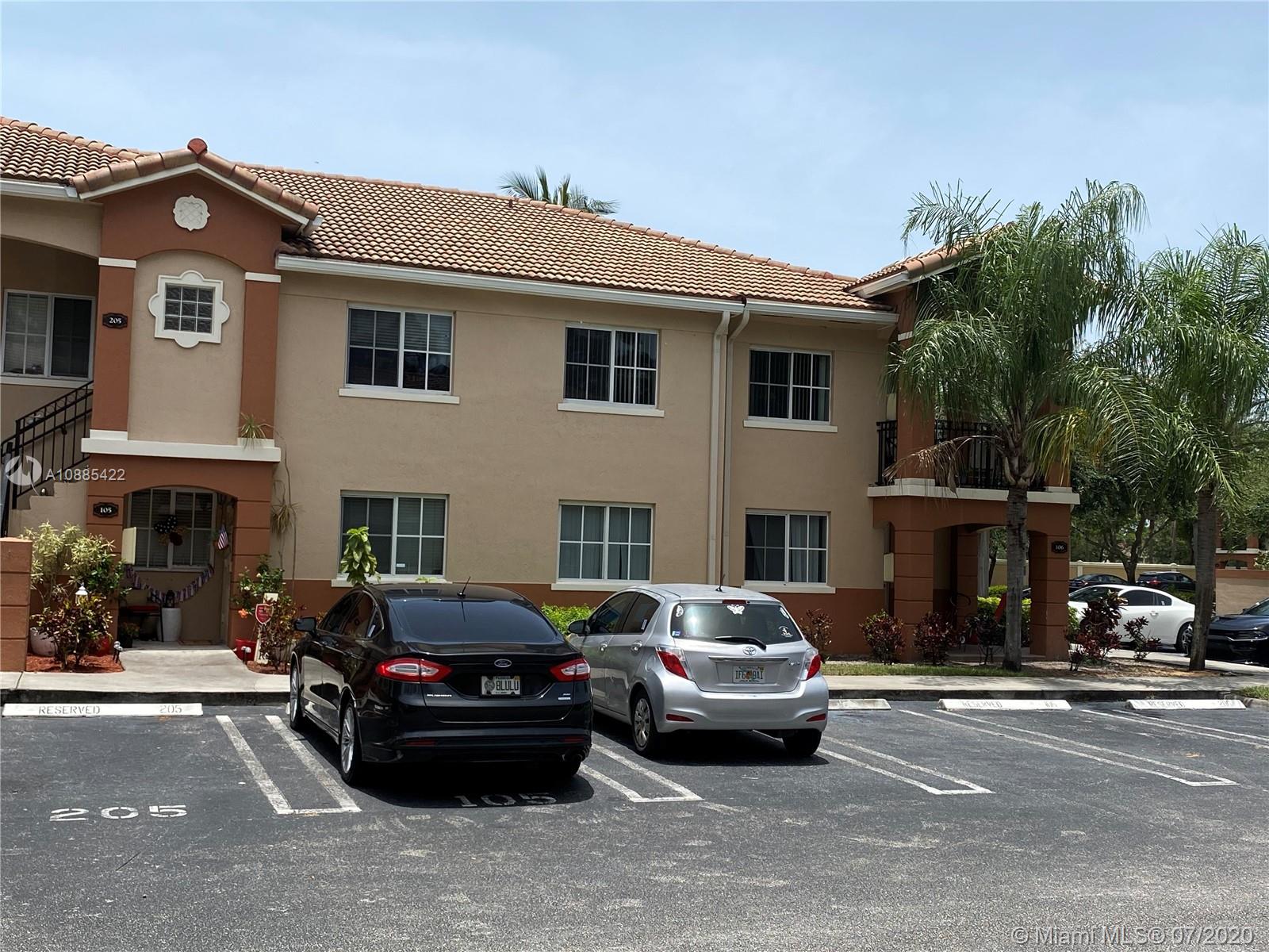 3750 North Jog Road, Unit 105 West Palm Beach, FL 33411 - Photo 5 of 8 a car parked in front of a building
