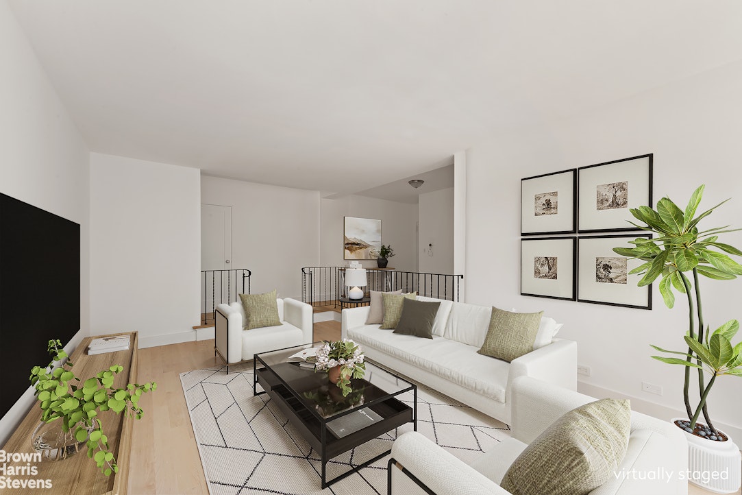98-41 64th Road, Unit 3G Queens, NY 11374 - Photo 2 of 14 a living room with furniture and a flat screen tv