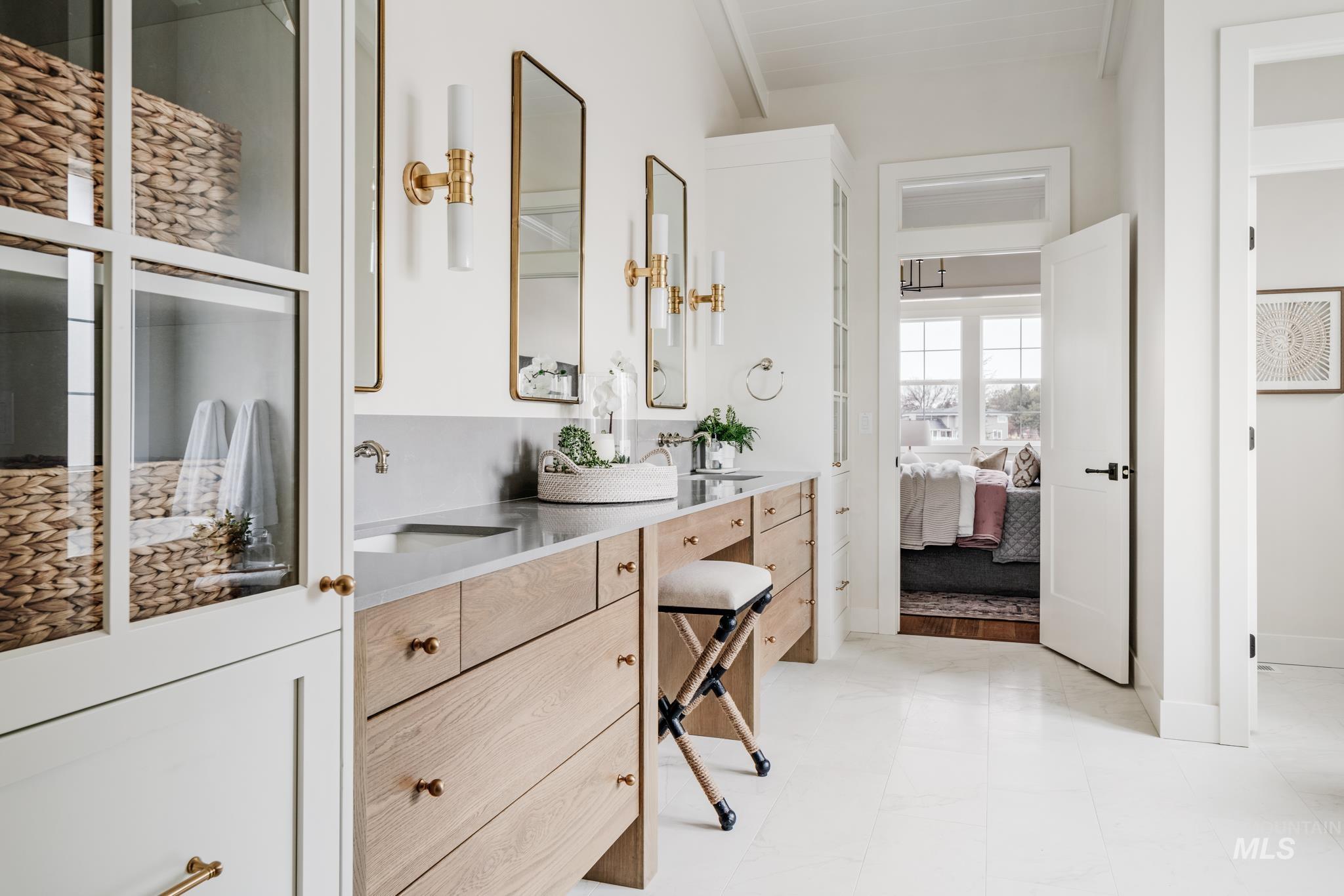 7448 North Cavea Lane Meridian, ID 83646 - Photo 17 of 40 Ensuite bathroom with double vanity and baseboards