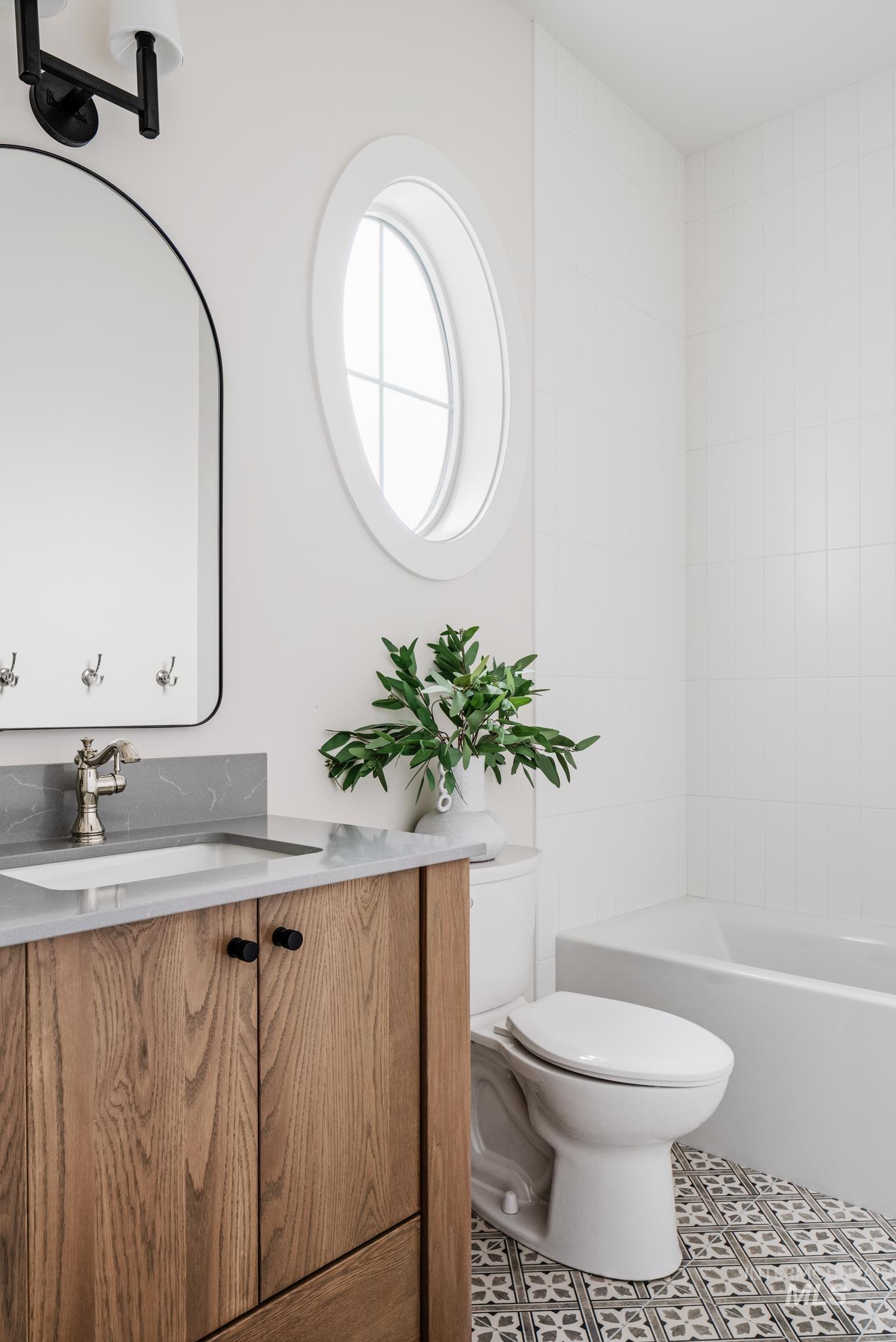 7448 North Cavea Lane Meridian, ID 83646 - Photo 25 of 40 Full bathroom with vanity, tile patterned floors, and shower / bathtub combination