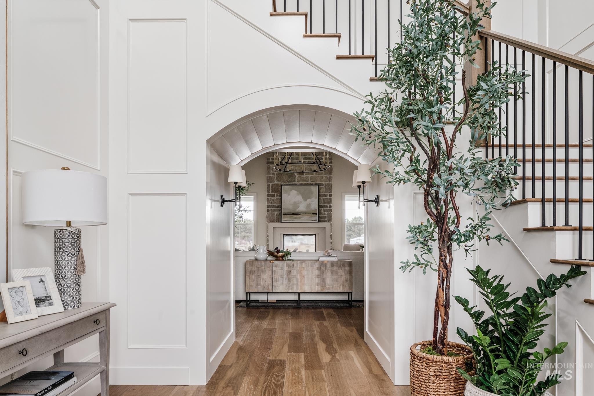 7448 North Cavea Lane Meridian, ID 83646 - Photo 38 of 40 Corridor with wood finished floors and stairway