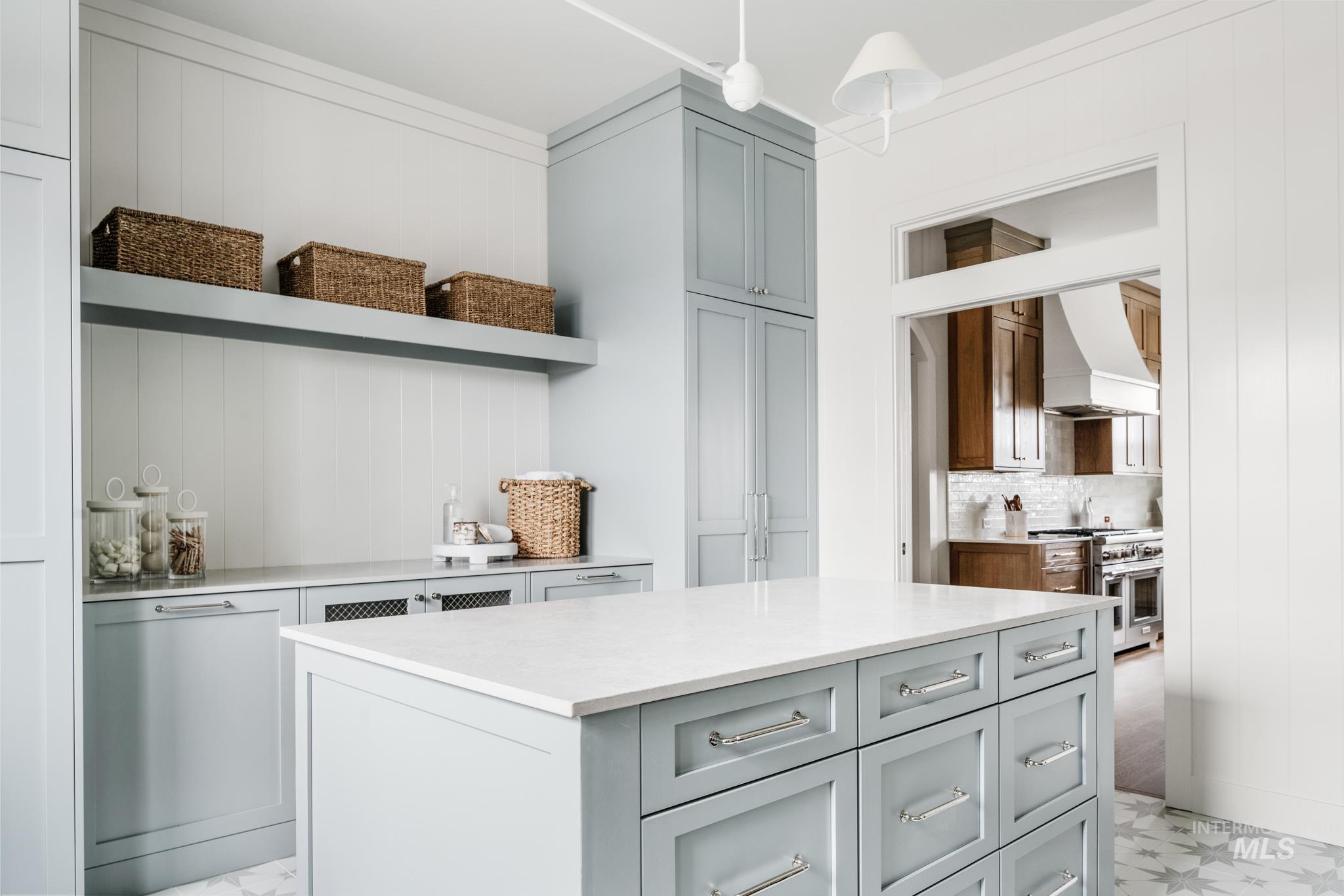 7448 North Cavea Lane Meridian, ID 83646 - Photo 8 of 40 Kitchen with open shelves, premium range hood, range with two ovens, and gray cabinets