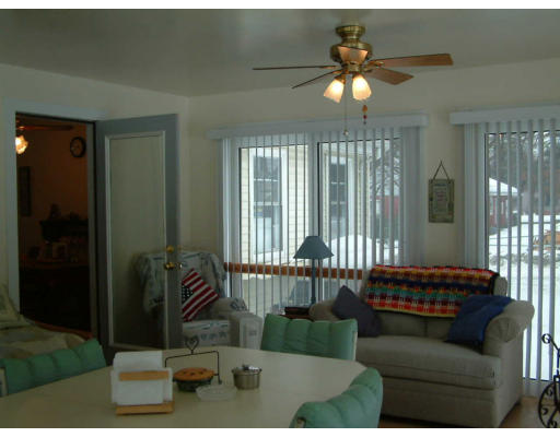 33 Manning Road Chelmsford, MA 01824 - Photo 2 of 3 a living room with furniture and a floor to ceiling window