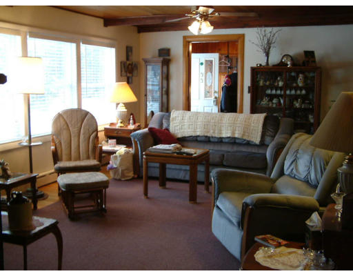 33 Manning Road Chelmsford, MA 01824 - Photo 3 of 3 a living room with furniture and a large window