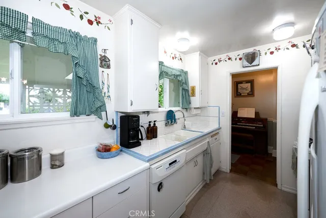 a kitchen with a sink and cabinets