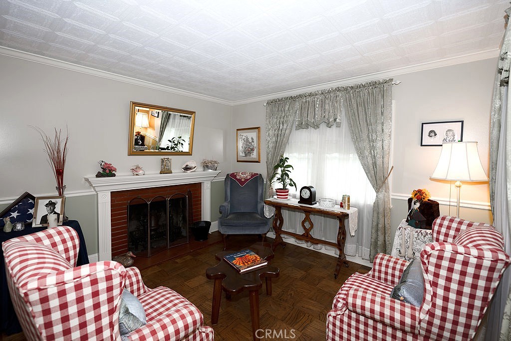8621 Winnetka Avenue Winnetka, CA 91306 - Photo 13 of 25 a living room with furniture fireplace and flat screen tv
