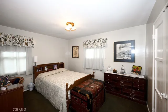 a bedroom with a bed and a closet