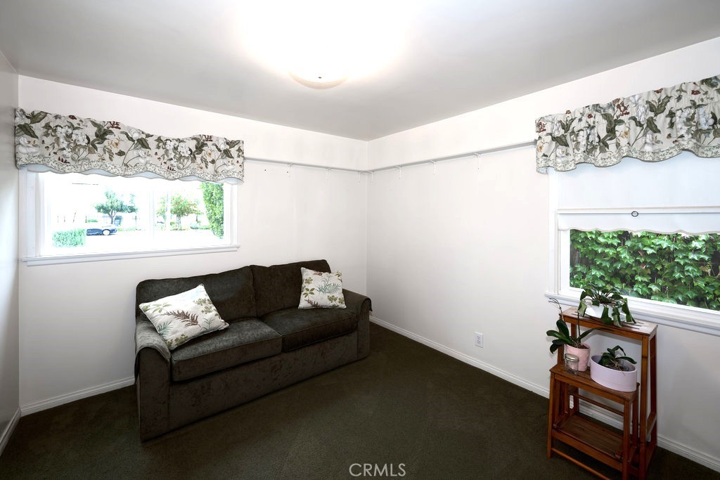 8621 Winnetka Avenue Winnetka, CA 91306 - Photo 18 of 25 a living room with furniture and a window