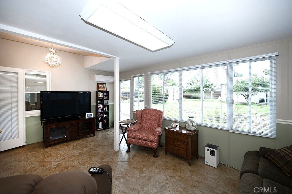 8621 Winnetka Avenue Winnetka, CA 91306 - Photo 21 of 25 a living room with furniture and a flat screen tv
