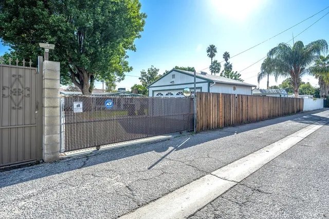 a backyard of a house with palm tree