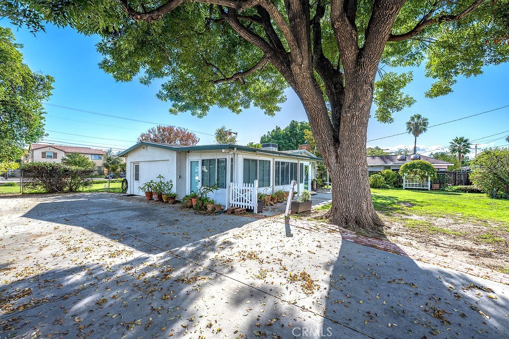 8621 Winnetka Avenue Winnetka, CA 91306 - Photo 10 of 25 a front view of a house with yard patio and tree