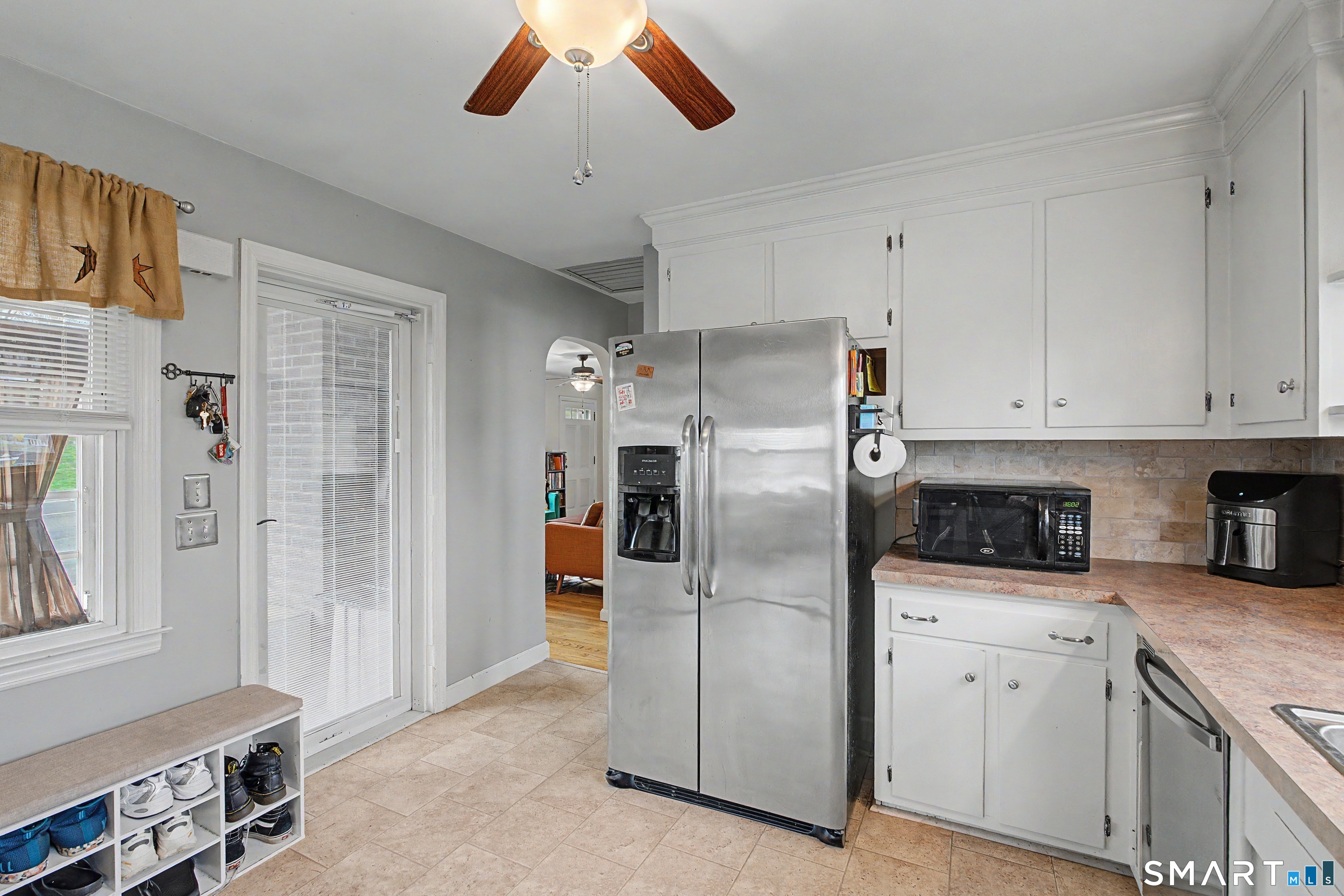 65 Jones Hill Road West Haven, CT 06516 - Photo 13 of 40 a kitchen with stainless steel appliances white cabinets and a refrigerator