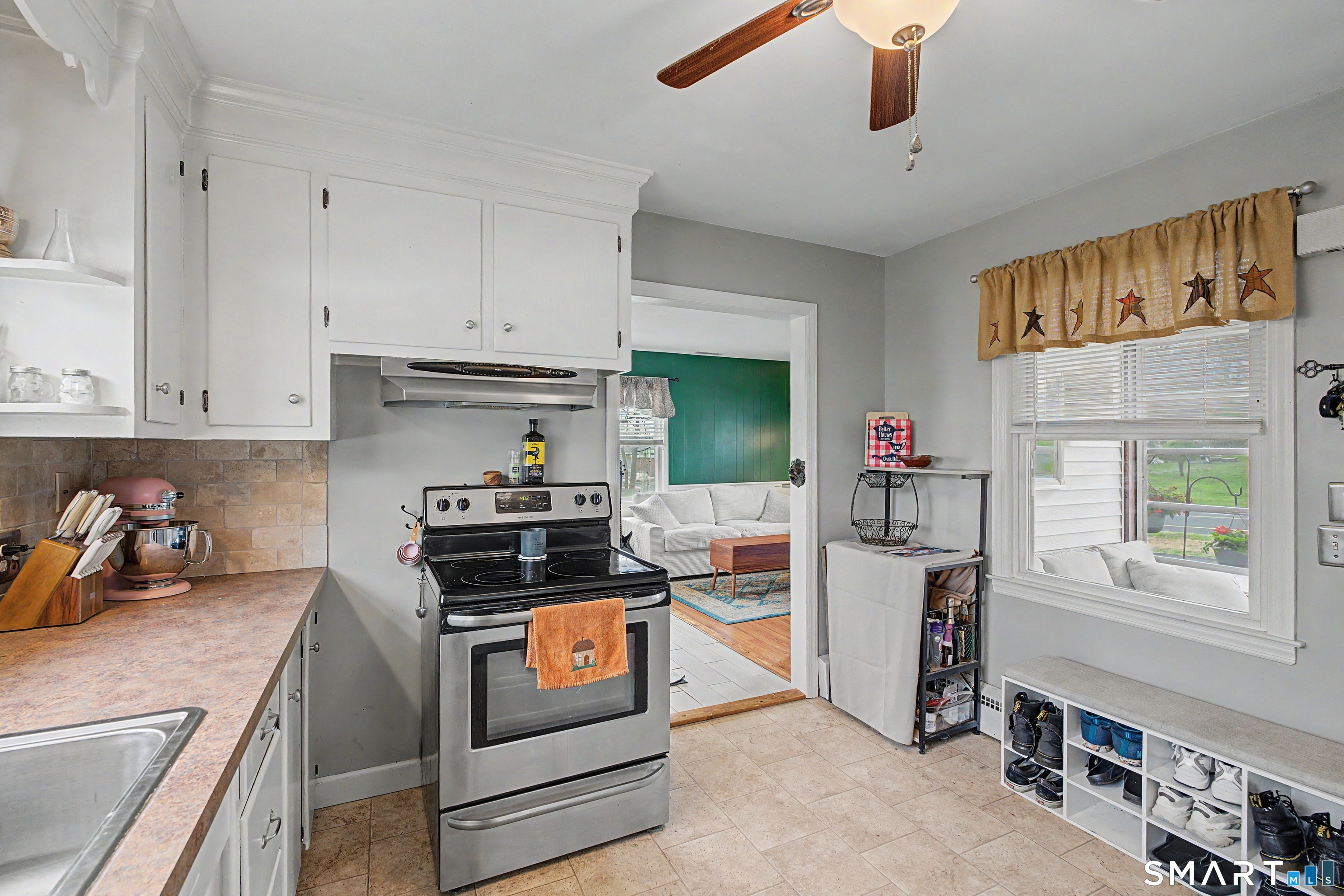 65 Jones Hill Road West Haven, CT 06516 - Photo 14 of 40 a kitchen with stainless steel appliances granite countertop a stove a sink and a refrigerator